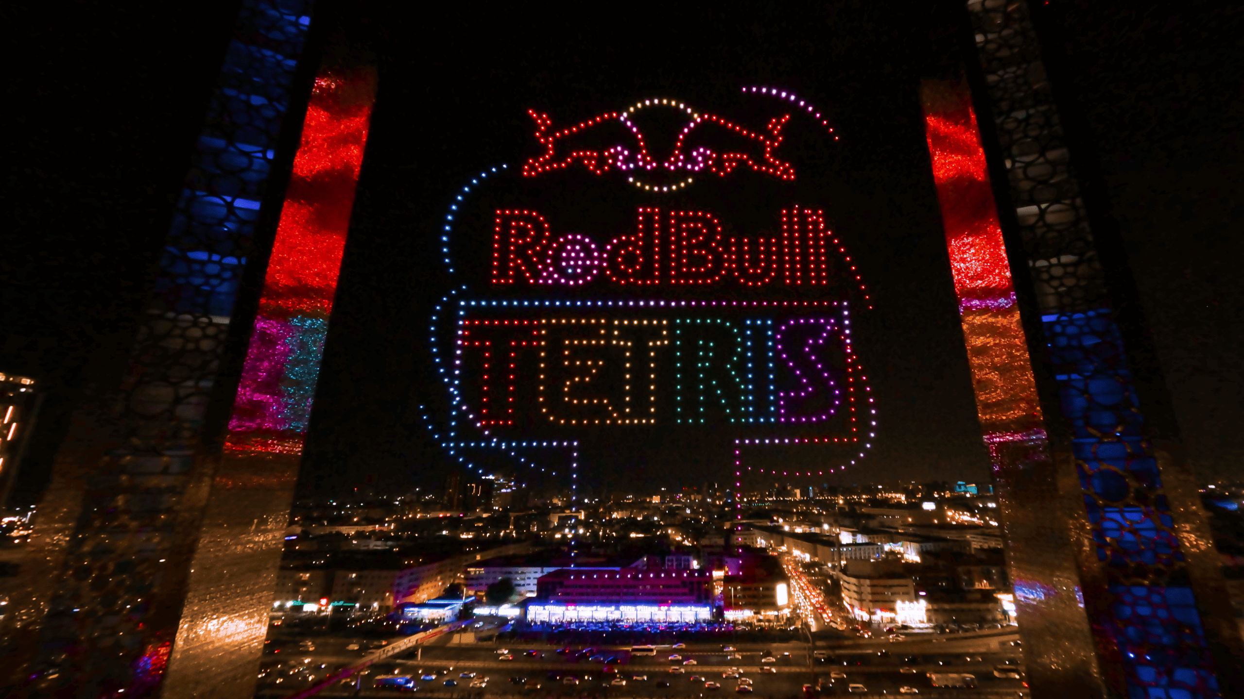 During the Red Bull Tetris Final in Dubai, drones form a glowing Red Bull Tetris logo in the night sky above the city venue as part of the 4,000 Drone Show by Lumasky.